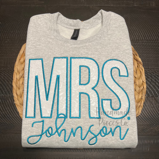 Gray sweatshirt with 'MRS Johnson' text
